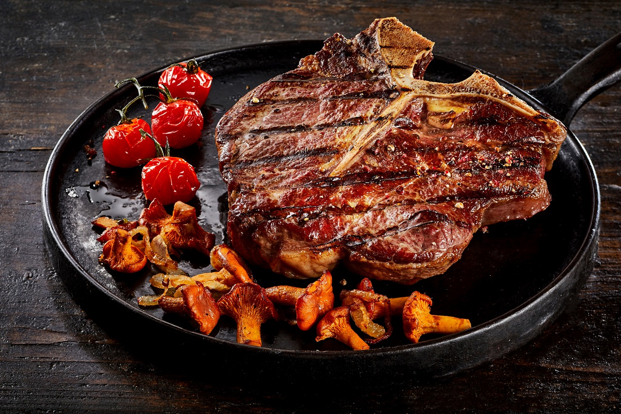 Grilled-porterhouse-steak-cooked-over-summer-BBQ