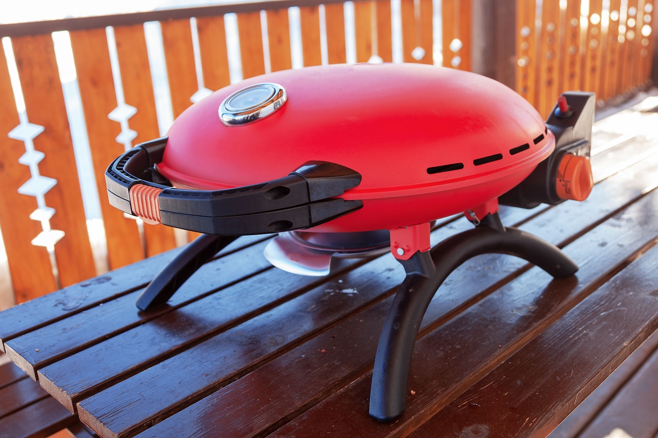 red-portable-barbecue-grill-at-outdoor-on-gas
