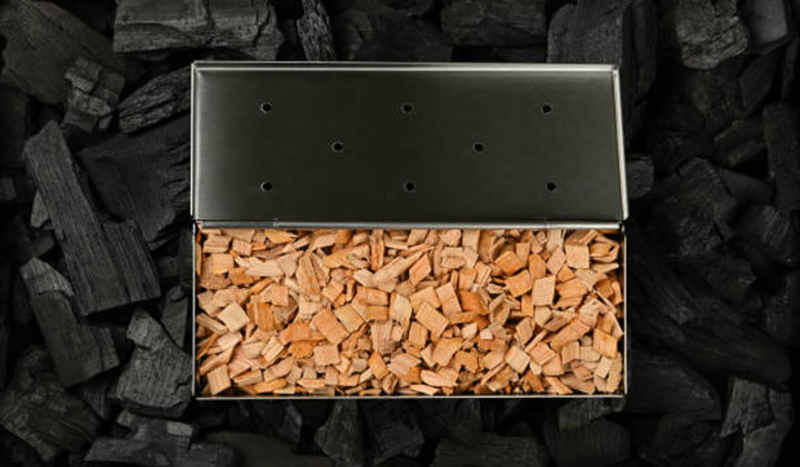 Load wood pellets/chips in the smoker box
